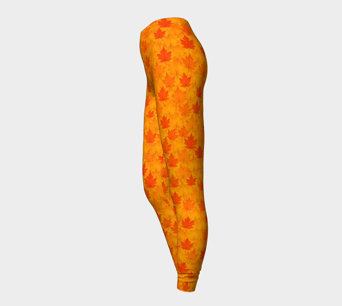 Leggings with orange and red maple leaf pattern on a light gray background