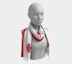 Mannequin wearing a scarf with a red maple leaf design on a white background