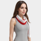 Woman wearing a red and white scarf on a plain background