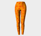 Orange leggings with leaf pattern on a light gray background