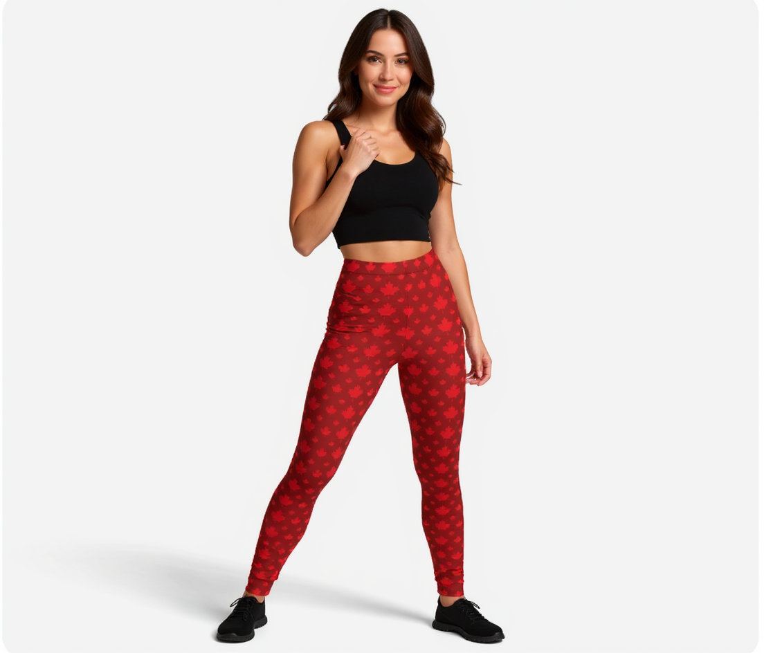 Woman wearing red patterned maple leaves leggings and black top on a white background
